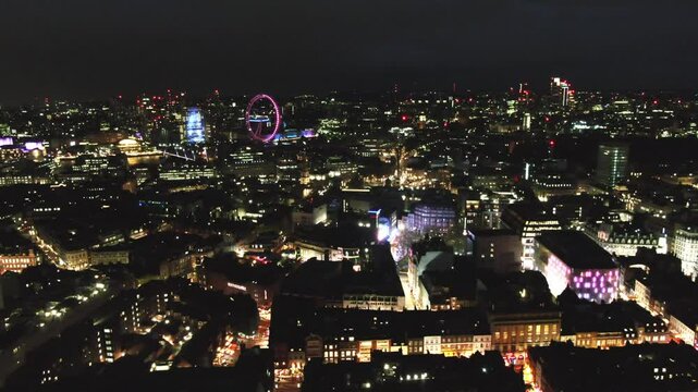 Aerial drone video of London cityscape at night