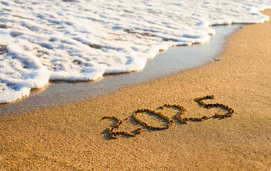 Sandy Beach, Sea Wave And The Inscription 2025. New Year 2025 Concept
