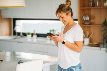 happy Woman smiling using smartphone