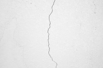 Abstract background of a textured wall with crack in the middle of the picture