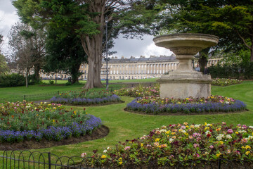 A view through Royal Victoria Park to the The Royal Crescent, a row of thirty terraced houses in the city of Bath,