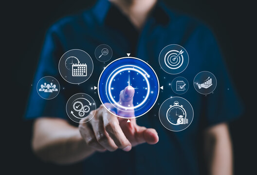 Time management and project planning technology concept. A person interacts with icons for time management, project planning, target setting, task tracking, business efficiency, and productivity. - Powered by Adobe