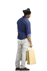 A man, full-length, on a white background, with bags