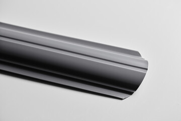 Metal siding for fence, roof, blinds, metal profile isolated on white background close-up