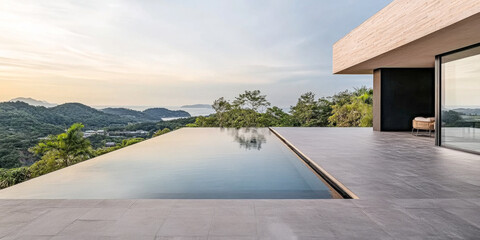 Obraz premium Modern villa with infinity pool overlooking mountain landscape at sunrise