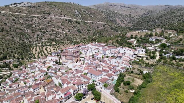 Taking a drone shot, one could spot a charming Village surrounded by lush Hills, Alpandeire, Malaga, Andalucia, Spain