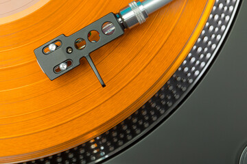 Turntable pickup arm on colored vinyl, top view © eyewave