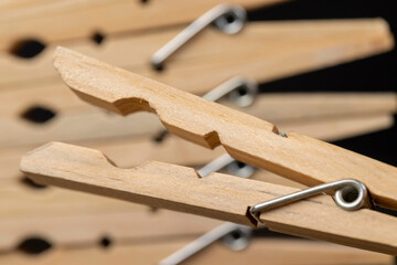 a group of wooden clothespins for drying clothes
