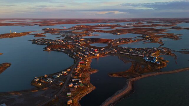 Morning Sunlight Over Houses In Tuktoyaktuk Hamlet, Northwest Territories, Canada. aerial shot