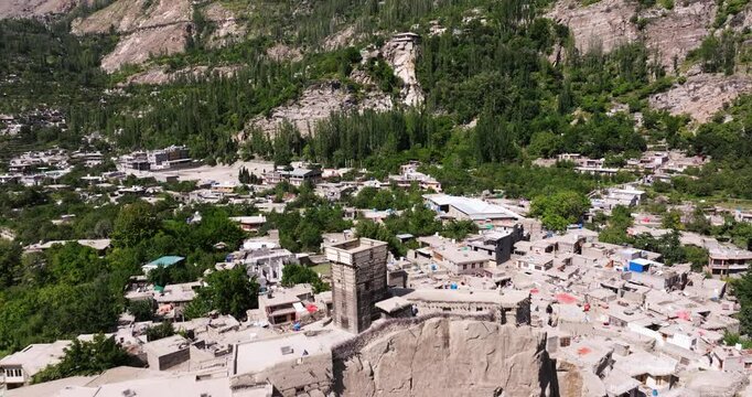 Aerial Pullback Reveals Altit Fort in Hunza Valley, Pakistan, Capturing the Fort&rsquo;s Strategic Hilltop Location Amid the Stunning Summer Scenery of Northern Pakistan.