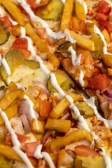 pizza with pickled cucumbers and French fries