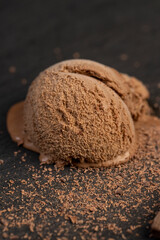 chocolate ice cream with chocolate chips on black slate