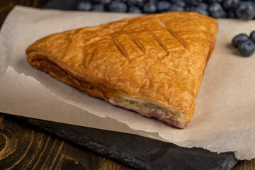 close-up of a blueberry stuffed bun with blueberries