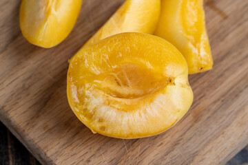 ripe soft apricot fruits on the cutting board