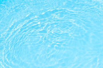 Blue water with ripples on the surface. Defocus blurred transparent blue colored clear calm water...