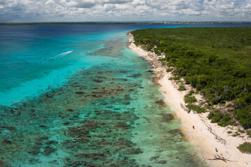 Top view of Catalina beach at sunny day, crystal clear sea and beautiful sandy beach,one people walk alone, Caribbean sea.Catalina island.Dominican Republic.