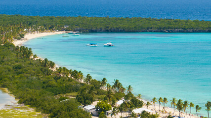 Panorama of Catalina bay, crystal clear sea, luxury yacht and beautiful sandy beach,Caribbean sea.Catalina island.Dominican Republic.