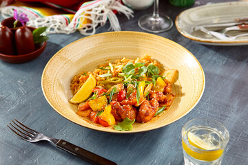 Vibrant Sweet and Sour Chicken with Peppers and Vegetables on Rustic Blue Table