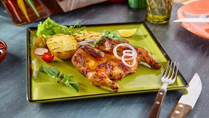Grilled Chicken with Potatoes on Vibrant Green Plate - Rustic Charm and Delicious Presentation