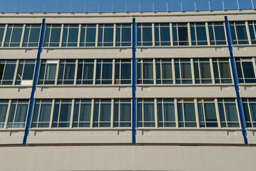 detail of facade modular windows of a modern university building, designed with linear glass, for efficient working comfort. The energy class today is one of the most evaluated and studied standards.