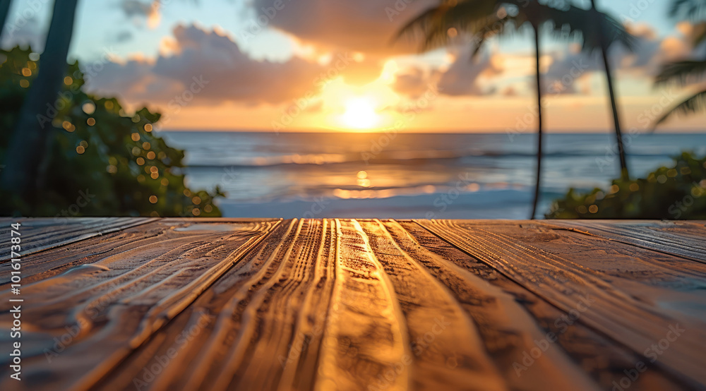 Poster A close-up shot of an empty wooden table, with a clear view of the tropical beach as its backdrop at sunset.