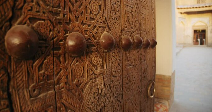 Old Wooden Gates to Madrasah Mohammed Rahim Khan. Khiva Uzbekistan Fortress Ichan Kala 5