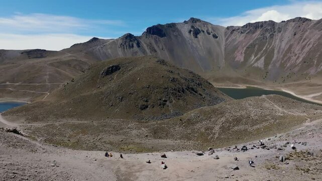 Pan left drone flight reveals Quetzal Pass, Laguna de la Luna, and Laguna del Sol in Nevado de Toluca crater, Mexico