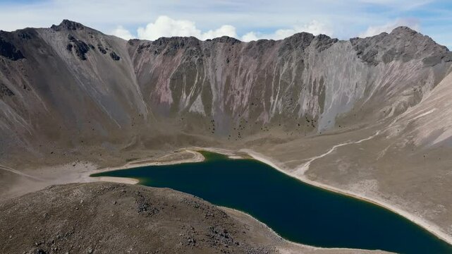 Nevado de Toluca volcano and Laguna del Sol during dry season, Mexico. Backward drone aerial reveals Toluca mountain
