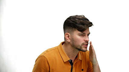 A man, close-up, on a white background, tells a secret