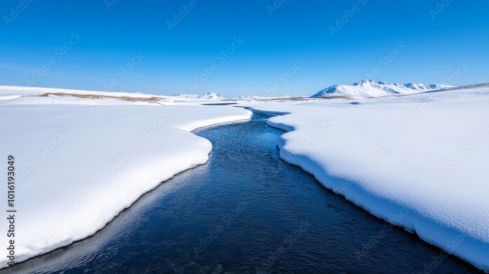 Sticker Calm winter river flowing through snow-covered banks with empty space over the clear blue sky for text 