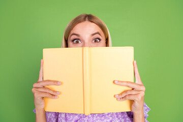 Photo of lovely adorable cute girl wear trendy purple clothes hold book isolated on green color background