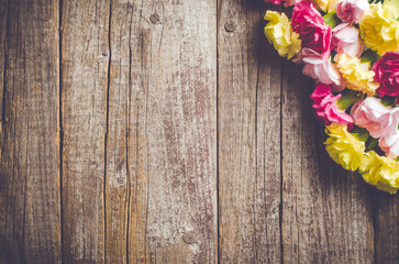 Fototapeta premium Carnation flowers on wooden table