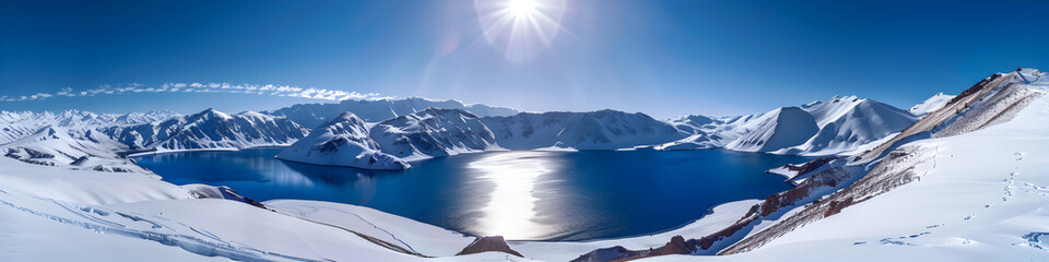 Majestic Snow Covered Mountain Range Under Bright Sunlight in Panoramic View in background