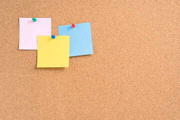 Cork board with colorful blank notes