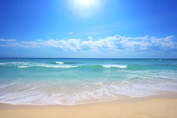 Obraz premium A pristine beach with golden sand leading up to the azure waters of the ocean