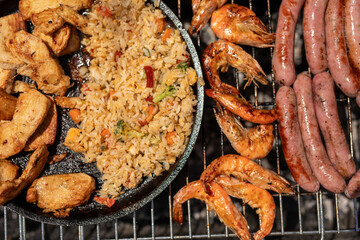Grilled chicken shrimp sausage and fried rice a barbecue feast