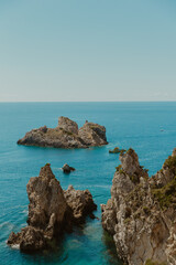  Rocky Island Landscape in Clear Blue Sea