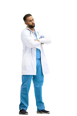 The doctor, in full height, on a white background, crossed his arms