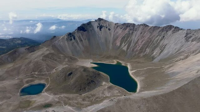 Panoramic drone view of Laguna del Sol and Laguna de la Luna inside Nevado de Toluca volcanic crater, Mexico. Orbit aerial