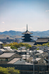 View of Pagoda over City and Mountains in Kyoto, Japan