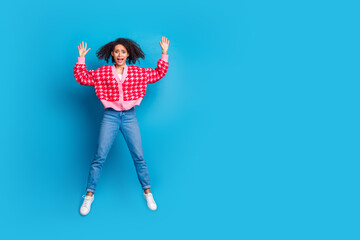 Portrait photo of young shocked woman jumping raised hands up afraid looking into cadre isolated on...