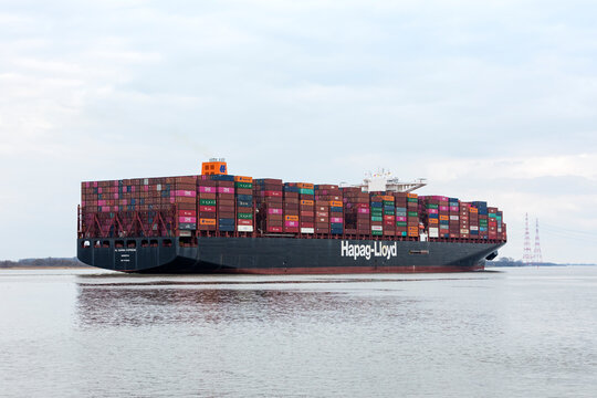 Stade, Germany &ndash; March 19, 2023: Container ship AL DAHNA EXPRESS operated by Hapag-Lloyd on Elbe river heading to Hamburg.