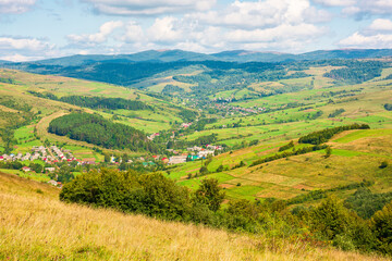 Fototapeta premium mountainous countryside scenery of ukraine on a sunny autumn day. rolling hills and grassy pastures