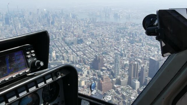New York City helicopter cabin flight, heli cockpit flying over Manhattan, United States. World Trade Center tower, Downtown, Tribeca. Extreme tourism, travel USA. Camera shaking. Control panel.