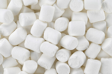 Background of white mini marshmallows. Top view. Completely in focus.