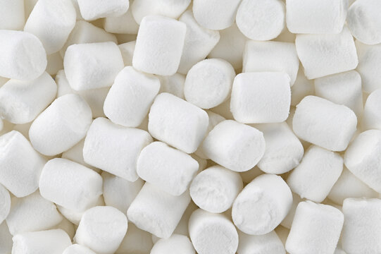 Background of white mini marshmallows. Top view. Completely in focus.