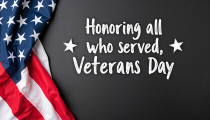 A photograph of a folded American flag on a black background with the text "Honoring all who served, Veterans Day" written in white chalk. 
