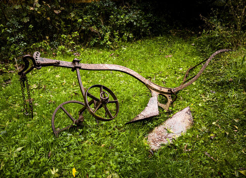 Vintage, old metal abandoned farming plough