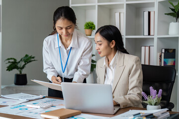 Professional Business Meeting in Modern Office with Diverse Team Collaborating on Project Strategies and Analyzing Financial Data