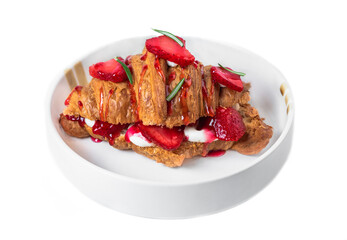 Sweet croissant with strawberry, jam and fresh cream in white plate on white background